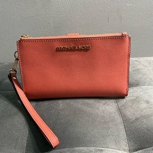 Micheal Khors peach wristlet wallet